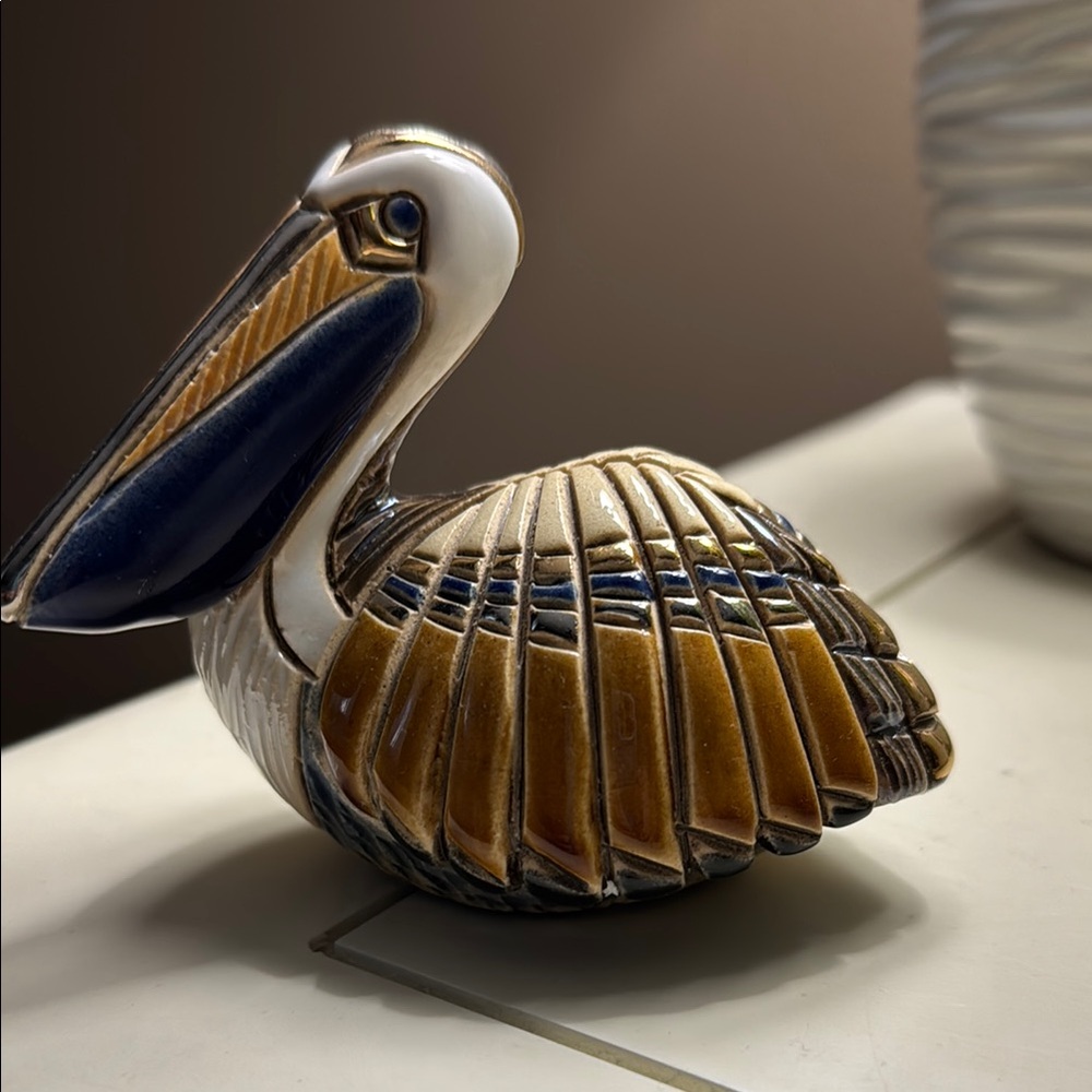 Brown and Blue Ceramic Pelican Art Piece